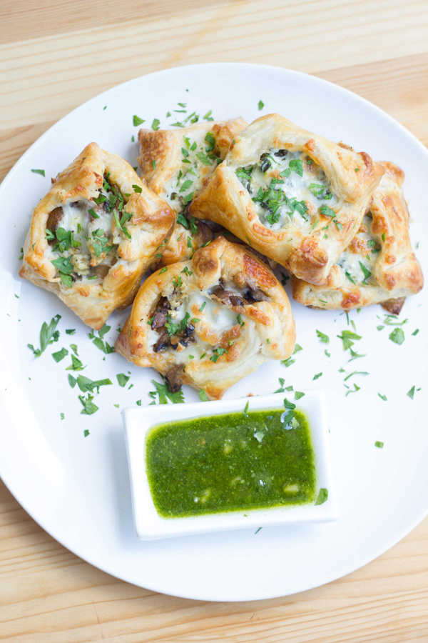 Savory tarts made with puff pastry filled with truffle mushrooms and spinach goat cheese topped with melted mozzarella! 