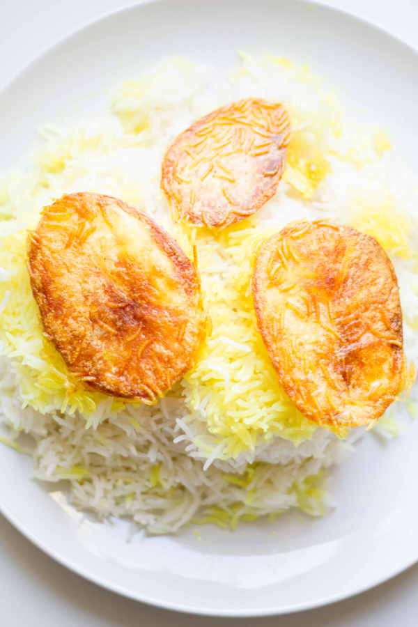 This divine Persian rice recipe shows you how to make the fluffiest rice side dish with crispy potatoes! | www.seriousspice.com